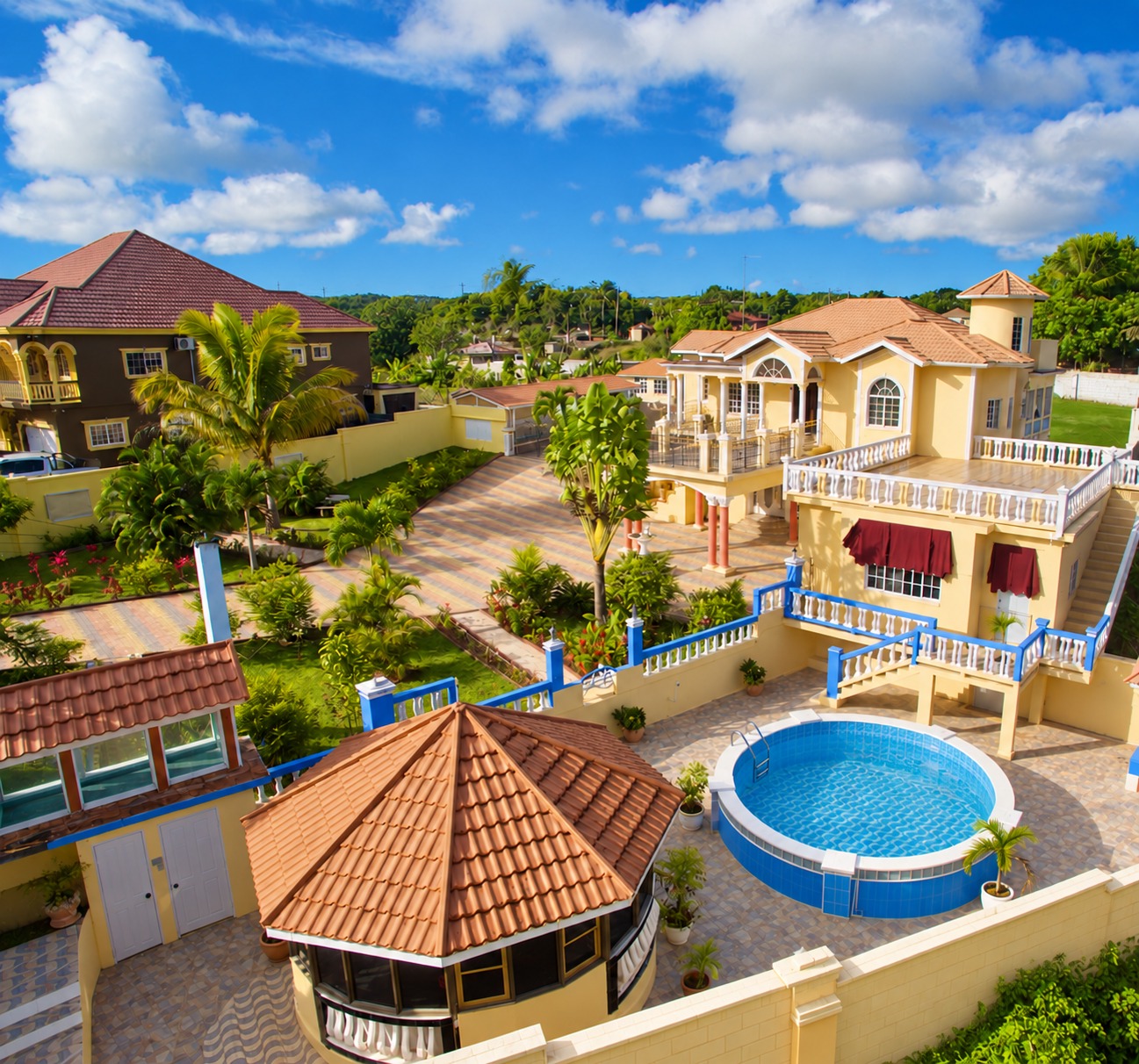 Aerial view of Driven & Divine Villa: the lawn and garden, the terraces, pool and bar lounge